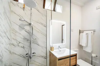 a bathroom with a shower and a sink at Villa Sea Shore by Villa Plus in Gaula