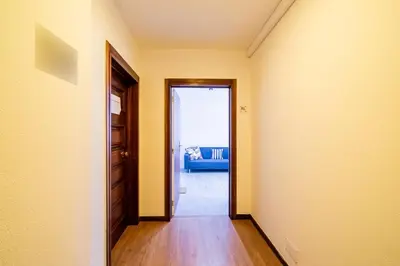 an empty hallway with a door leading to a living room at JMF Flats in Funchal