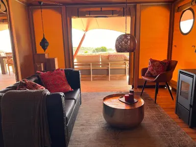 a living room with a couch and a table at Quinta Aurora in Burgau