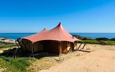 a large tent on the beach near the ocean at Quinta Aurora in Burgau