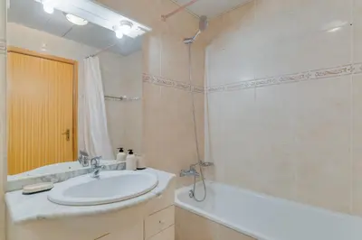 a bathroom with a sink and a bath tub at Isabel Apartment by Holiday Rental Madeira in Ribeira Brava