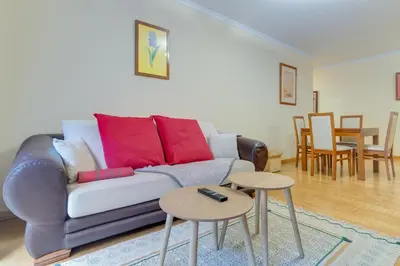 a living room with a couch and two tables at Isabel Apartment by Holiday Rental Madeira in Ribeira Brava