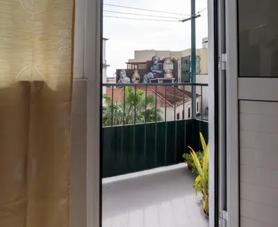 a view from a window of a balcony at City Heart Funchal in Funchal