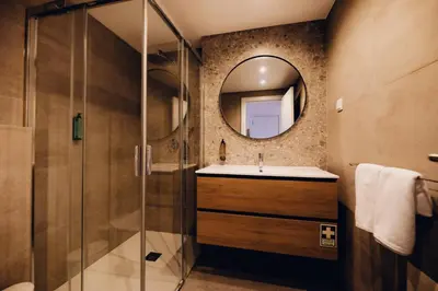 a bathroom with a sink and a mirror at Casas do Calhau Miúdo - Seixal in Seixal