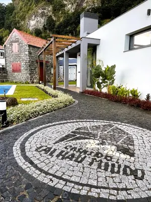 a mosaic tile floor in front of a house at Casas do Calhau Miúdo - Seixal in Seixal