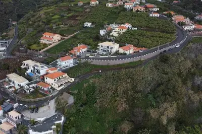 an aerial view of a road on a hill with houses at Lombo do Doutor Cottage 2 by Mth in Calheta