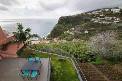 a view of the ocean from the balcony of a house at Lombo do Doutor Cottage 2 by Mth in Calheta