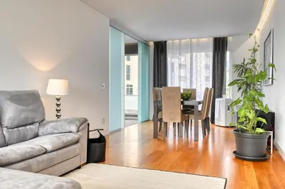 a living room with a couch and a table at Jasmineiro, a Home in Madeira in Funchal