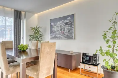 a dining room with a table and chairs at Jasmineiro, a Home in Madeira in Funchal