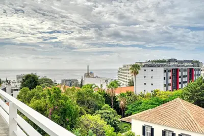 a view of a city from a balcony at Jasmineiro, a Home in Madeira in Funchal