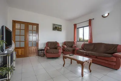 a living room with two couches and a coffee table at Villa Bartoni in Aljezur
