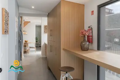 a hallway of a house with a vase on a counter at Calheta beautiful character cottage Villa Loreto in Arco da Calheta