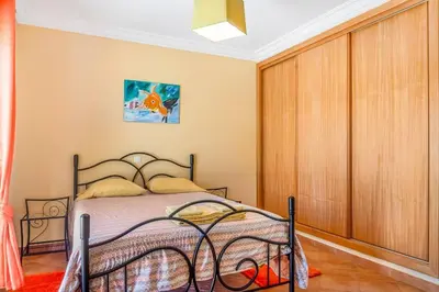 a bedroom with a bed in a room at Moradia com piscina e vista Mar in Aljezur