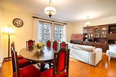 a living room with a table and a couch at GuestReady - Varanda de belas lembranças in Funchal