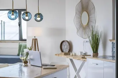 a kitchen with a table with a laptop on it at Casa Jose Antonio A by Homie in Gaula