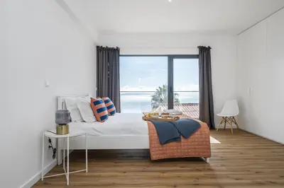 a bedroom with a bed with a view of the ocean at Casa Jose Antonio A by Homie in Gaula