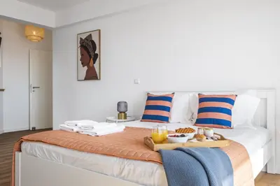 a bedroom with a bed with a tray of food on it at Casa Jose Antonio A by Homie in Gaula