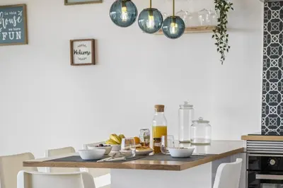 a kitchen with a table with food on it at Casa Jose Antonio B by Homie in Gaula