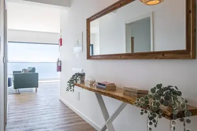 a mirror on the wall of a room with a table at Casa Jose Antonio B by Homie in Gaula