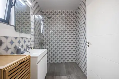 a bathroom with a sink and a mirror at Casa Jose Antonio B by Homie in Gaula