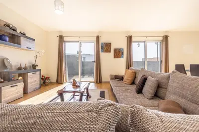 a living room with a couch and a table at Villa Angela- Madeira Inn Group in Calheta