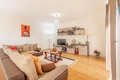 a living room with a couch and a table at Villa Angela- Madeira Inn Group in Calheta