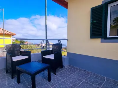 a bedroom with a bed with pillows on it at Santana Madeira Hiking Getaway near Pico Ruivo and Levadas Base in Santana