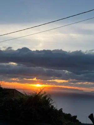a sunset over the ocean with the sun setting at Mazelia's House in Gaula