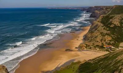 an aerial view of a beach next to the ocean at Casa Bellarosa in Raposeira