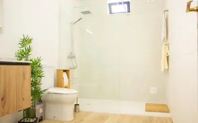 a bathroom with a toilet and a glass shower at Casa Bellarosa in Raposeira