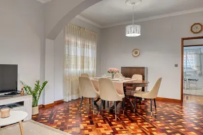 a dining room with a table and chairs at Villa Rosa, a Home in Madeira in Funchal
