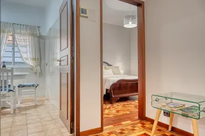 a room with a door leading to a bedroom at Villa Rosa, a Home in Madeira in Funchal