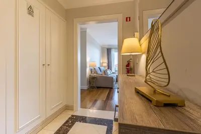 a living room with a mirror on a table at Ocean view and Infinity pool Apartment in Funchal