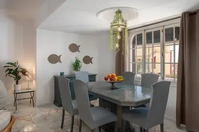 a dining room with a table and chairs at OurMadeira - BelleVeva in Funchal