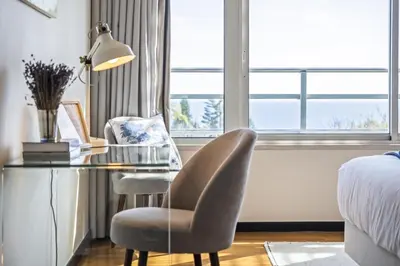 a bedroom with a desk and a chair and a bed at Lavender - By Wehost in Funchal