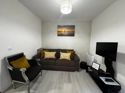 a living room with a couch and a television at Fisherman's house in Porto Moniz