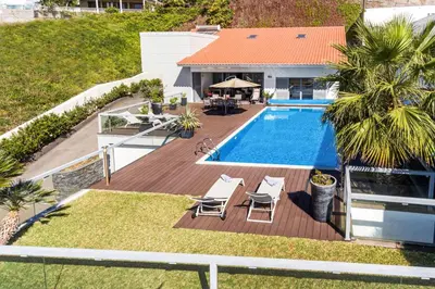 an aerial view of a house with a swimming pool at Villa Sol e Mar by Villa Plus in Caniço