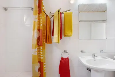 a bathroom with a white tub and a sink at Casa Conny in Caniço