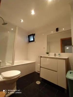 a bathroom with a toilet and a tub and a sink at Apartamento Quitéria - Funchal in Funchal