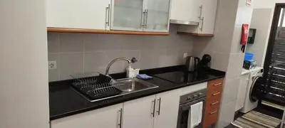 a kitchen with a sink and a counter top at Apartamento Quitéria - Funchal in Funchal