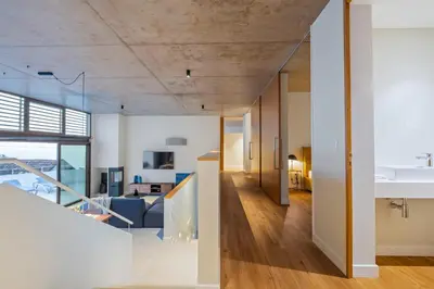 a view of the living room and dining room of a house at Lake House in Calheta