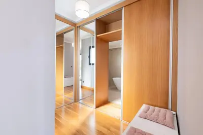 a room with a mirror and a pink bench at Yuri Big House in Ribeira Brava