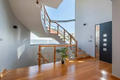 a staircase in a house with a stair case at Yuri Big House in Ribeira Brava