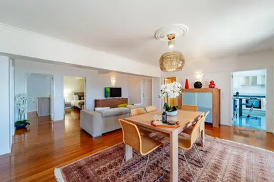 a living room with a table and a couch at Ana's Place in Funchal