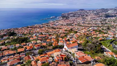 an aerial view of a city and the ocean at Ana's Place in Funchal