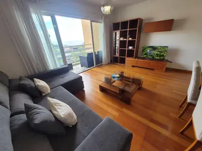 a living room with a couch and a table at Pilar Balconies in Funchal City in Funchal