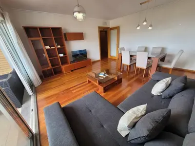 a living room with a couch and a table at Pilar Balconies in Funchal City in Funchal