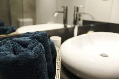 a bathroom with a sink and a toilet and a sink at GuestReady - A brilliant stay near the sea in Funchal