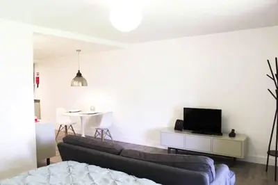 a living room with a couch and a tv and a table at GuestReady - A brilliant stay near the sea in Funchal