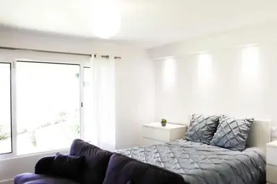 a bedroom with a bed and a large window at GuestReady - A brilliant stay near the sea in Funchal